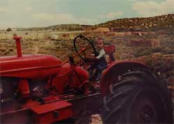 Baby on a tractor.